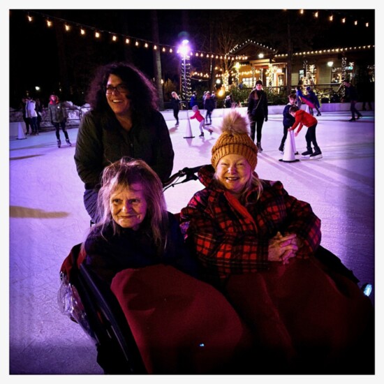 Residents from Mt. Bachelor Memory Care in Bend get out on the ice rink at Inn of the Seventh Mountain courtesy of Love Bike. Photo credit: Amy Castaño 
