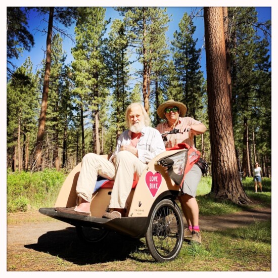 Van Fossan taking her friend on a Love Bike ride during his time on hospice. Photo credit: Amy Castaño  