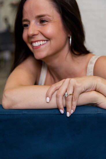 A floral-inspired setting highlights this marquise diamond ring. Modeled by Sierra Broschart.