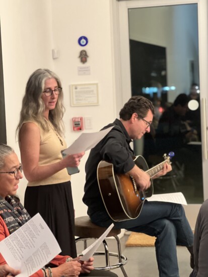 Abby K and Mark Ippolito leading a group sing-a-long