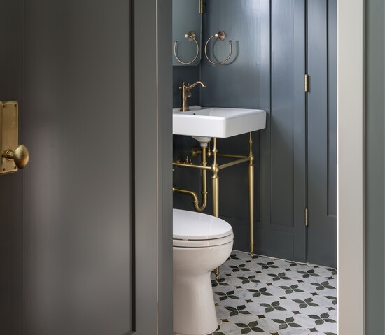 After: The refreshed bathroom features color drenching for a sophisticated finish.