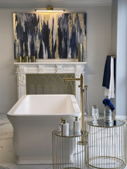 The fireside freestanding tub in the Royal Blue room invites you to relax + unwind.
