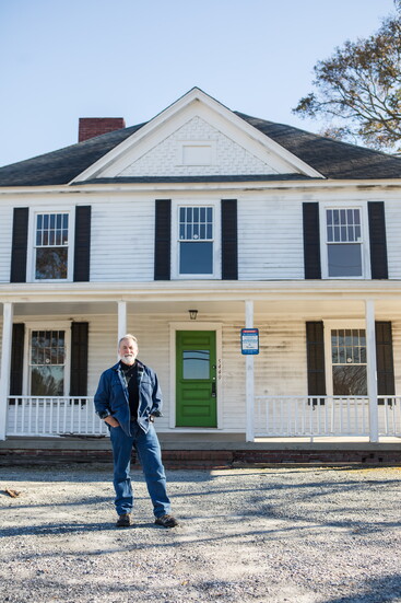 Chamblee resident, Matt Sitter, stands in front of the Blanton house, one of the many historical sites in Chamblee.