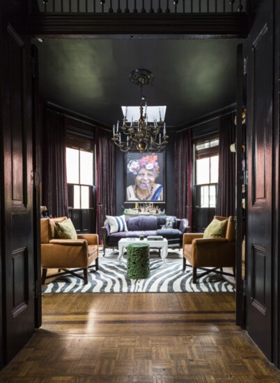 For her own historic vacation home in Louisville, Ky., designer Lucinda Loya created a bourbon room with deep, rich colors, antique pieces and lively art. 