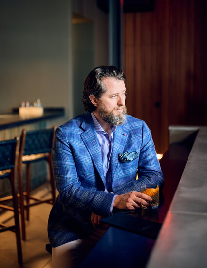 Nathan is dressed with an Isaia sport coat and sport shirt, Barmas pants, and Officine Creative loafers