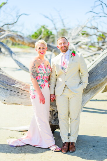 Sophia and Liam Gobeyn—her custom pink floral gown and his matching tie, created by Pink for a perfectly tailored moment. (Photo by John F Krivec)