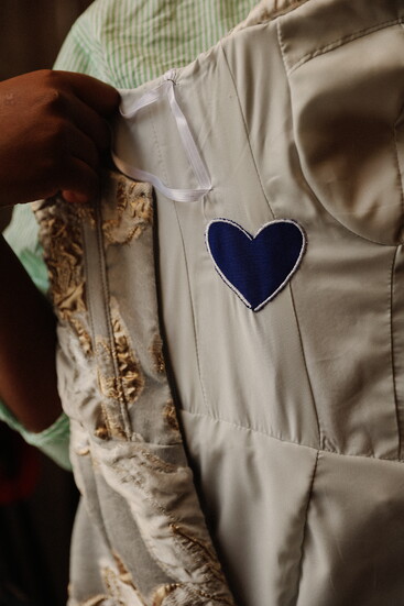 A sewn piece of her late mother’s wedding dress brings her presence into Kellogg’s gown. (Photo by Alison Hein)