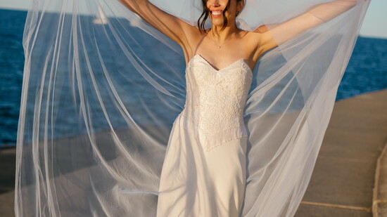 Katherine Fleischhauer in her renewed silk gown—timeless fabric, transformed with modern grace. (Photo by Melissa Stuckey)