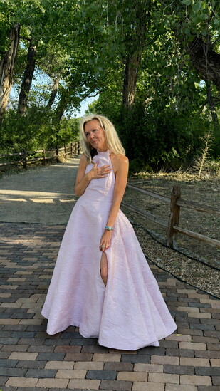 Monica Johnson wears a custom Nicole Pink gown with built-in support for effortless comfort and elegance. (Photo provided)
