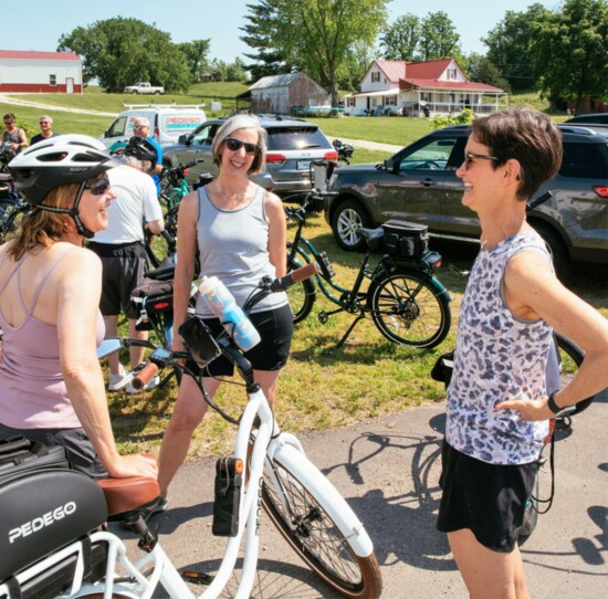 Teri Nicely (middle) talks with other Pedego bikers on the Katy Trail