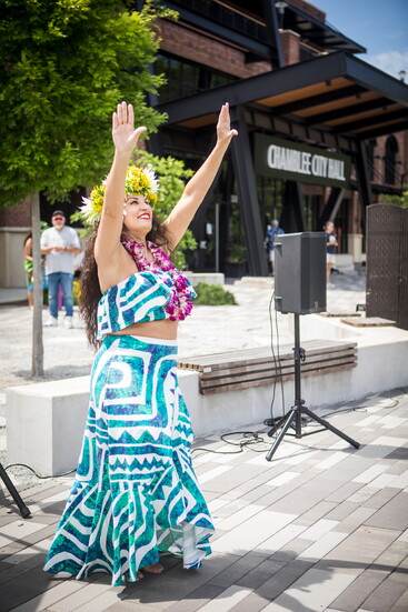 A performer dances in front of Chamblee City Hall. 