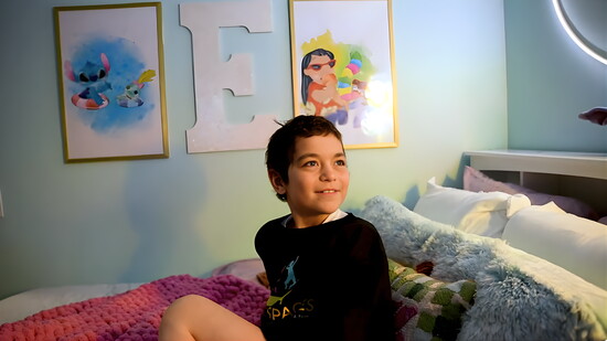 Eva taking in her new room with wide eyes and a full heart.