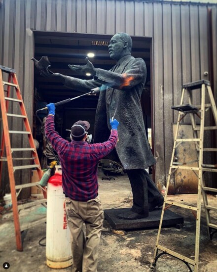 Putting a patina on the MLK statue near Mercedes-Benz Stadium in Atlanta