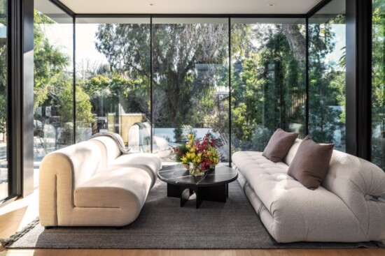 Dramatic glass window walls invite the outside in