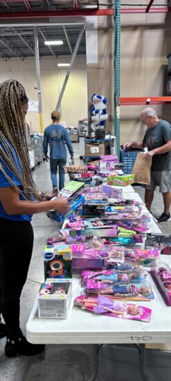 Volunteers sort through donated toys.