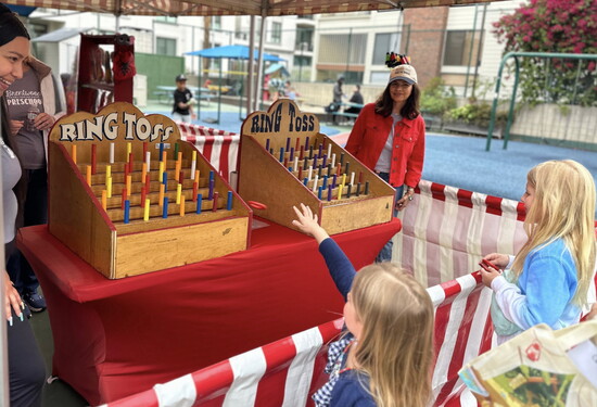 Students and teacher at the end-of-year Carnival