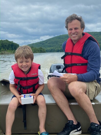 Cameron and his dad Ted enjoy a boating trip at Lake Ft. Smith State Park in Arkansas.