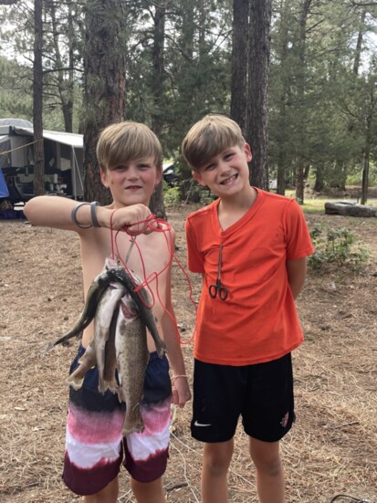 Drew on the left with brother Will show off their catch of the day for the camera in New Mexico.