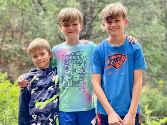 Cameron on the left with his brothers Drew and Will enjoying the great outdoors while on one of the family’s many camping trips.