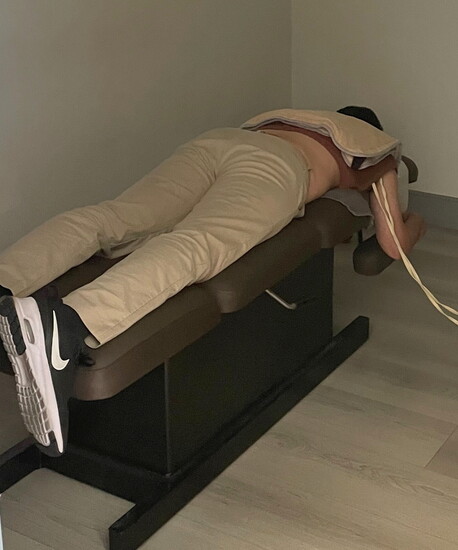 ESTIM treatment prepares Dr. Diba's patient for a chiropractic adjustment.