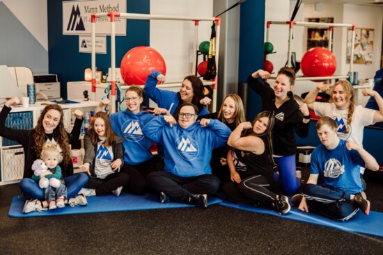 The Mann Method team celebrates with patients Belle, Violet, Tony, Grace and Connor.