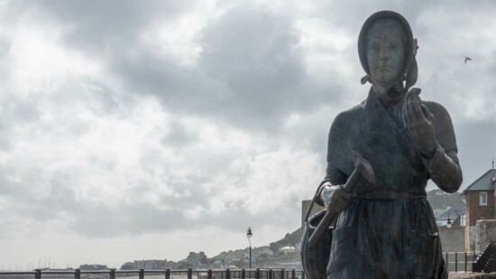 Statue of Mary Anning in Lyme Regis Dorset England
