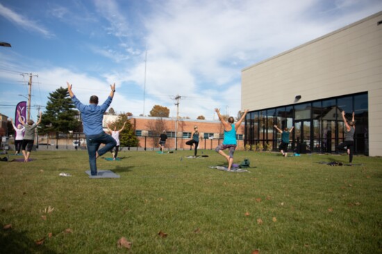 Rick does yoga on the KPAC west lawn