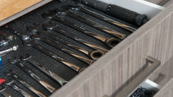 Custom cabinets help store and organize tools.