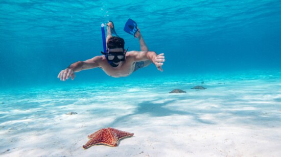A guest snorkeling. Courtesy Cancun Adventures