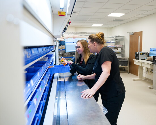 Amanda Tomaini and Patricia Greene in the new expanded laboratory and pharmacy department