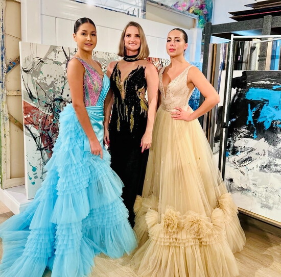 Julia with models in Julia Grace Couture at The Bayshore Arts District Inaugural Fashion Show 2024