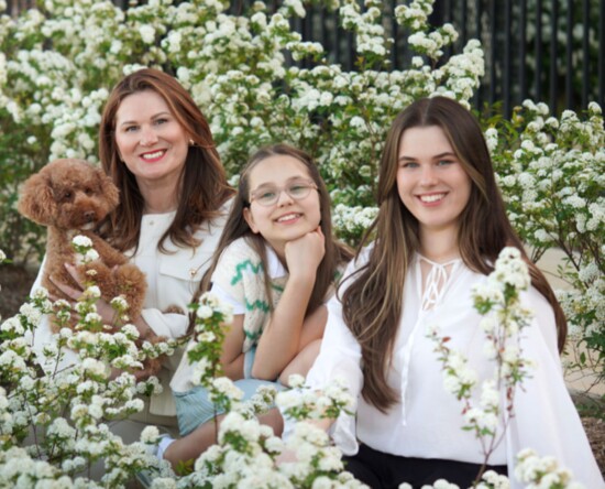 Jurgita with her daughters and miniature poodle, Tucci.