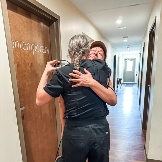 A grateful patient hugs Dr. Nicole Kurlbaum