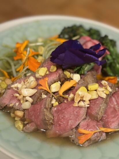 Chef Mac's Pho with rice noodles, beef tenderloin and broccolini in a miso broth