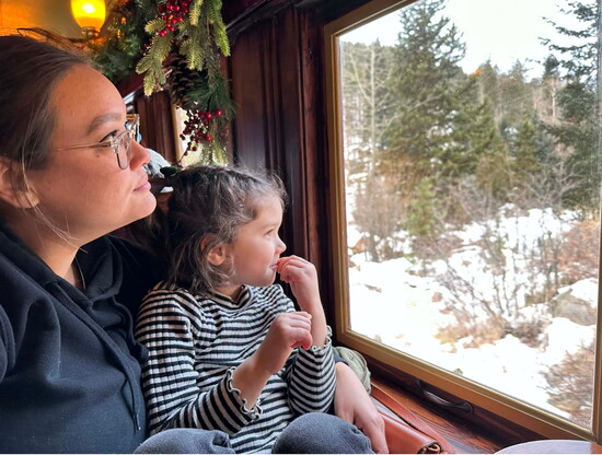 Jill and Harper Bradford looking out the window during their travels