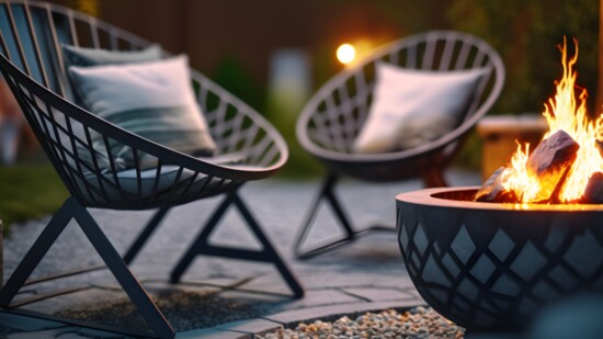 A pretty patio surrounded by artificial turf makes for a great gathering space that requires no water—or mowing. Photo by lublubachka