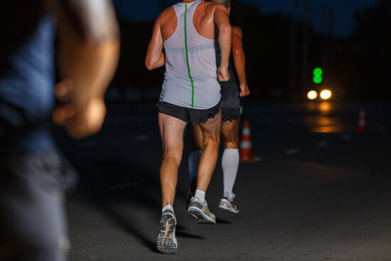 Men running in the early hours of the morning.