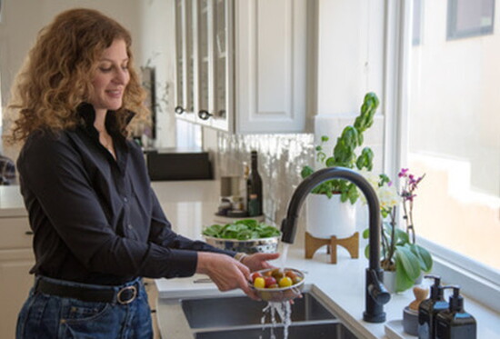 Dr. Meagan preps fresh, wholesome ingredients, the foundation of balanced nutrition for women.