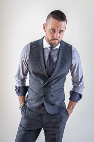 The grey flannel vest is finished with a peak lapel and double-breasted front for a modern nod to old world tailoring