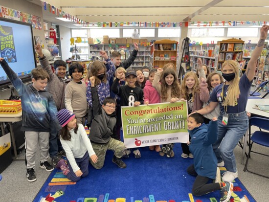 Carly Adams and her 5th grade class receiving grant for professional author