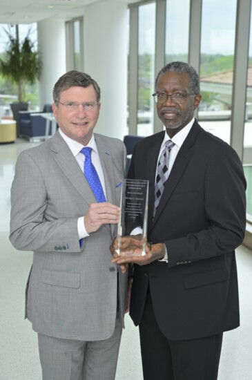 Chester County Hospital board member Timmy Nelson presents Michael Duncan with the Spirit of Belonging award.