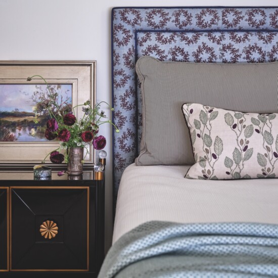 The lovely layers of fabric in the guest bedroom include a custom headboard upholstered in Leah O'Connell fabric, custom pillow shams in Rose Tarlow and Radish 