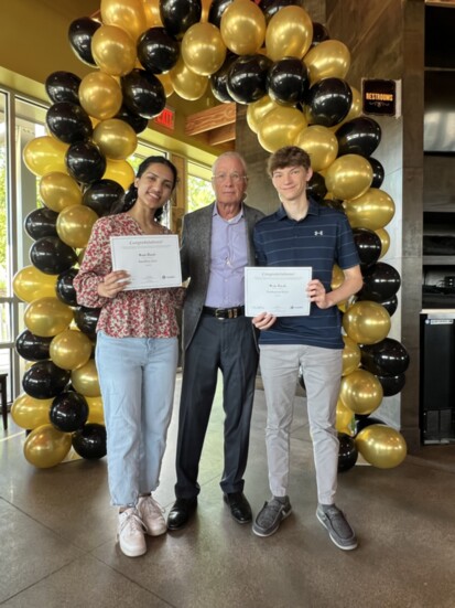 Russ Daub, developer of Midlands Place, with scholarship recipients