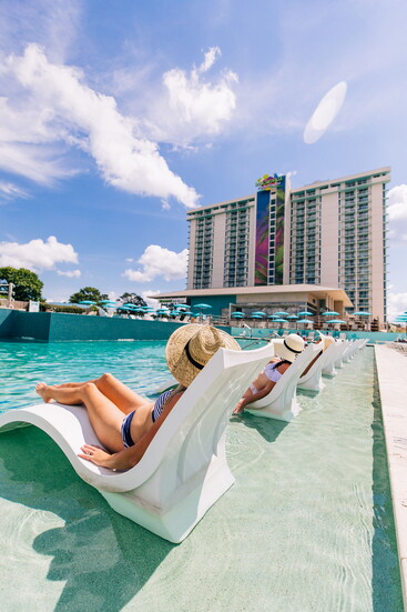 Poolside lounge seating and lake views create space to slow down, unwind, and let the weekend unfold without ever leaving Conroe.