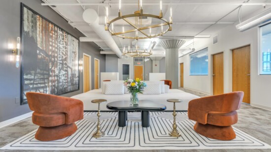 For this lobby, Yésely Love of Canaima Design chose a white modern sofa, curvy tables and a pair of burnt orange chairs.