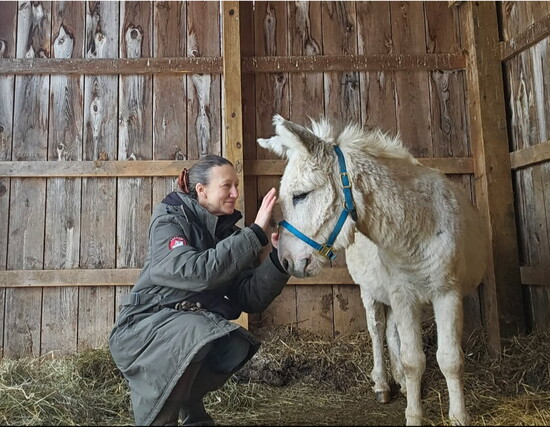 Laura Ann Chamberlain and one of her donkeys