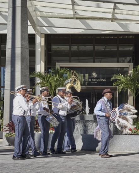 A band plays at the entrance of the Four Seasons New Orleans 