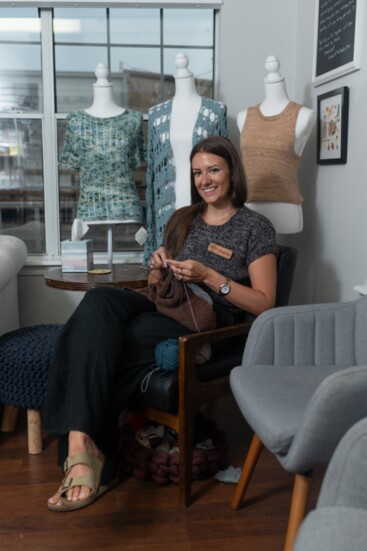 Sharon Graff, owner, in knitting room. 