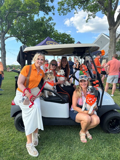 Joanne Dalessandro (seated in cart) is joined by friends & supporters for a "Yappy Hour" at the Club at Wynstone.