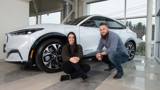 Chrissy Monaco and Mike Monaco, with the new all-electric Mustang Mach-E.